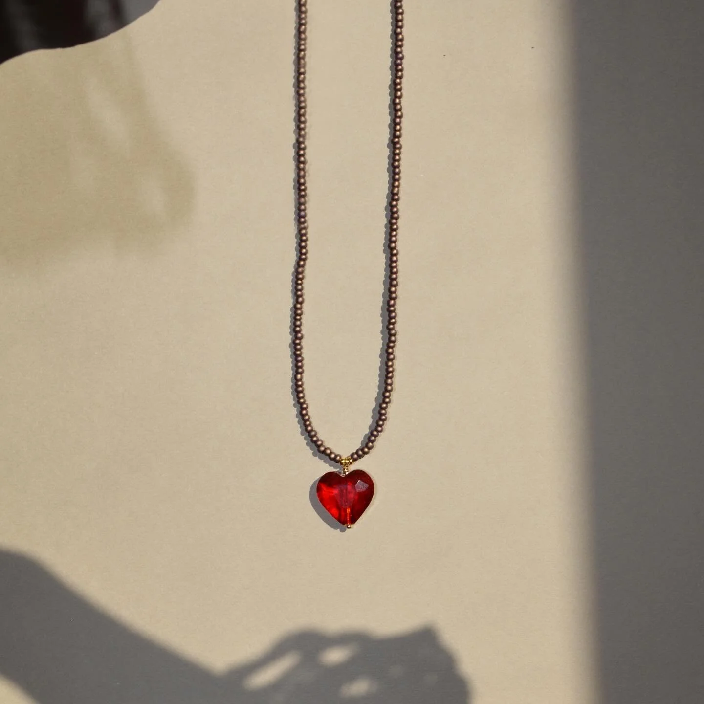 Happy New Year, happy Friday. My brain thinks it&rsquo;s Monday because I didn&rsquo;t work yesterday🫠. 
This is one of my new favorite necklaces the Cocoa Heart Necklace, I&rsquo;ve worn it with so many things this season and it will move right int