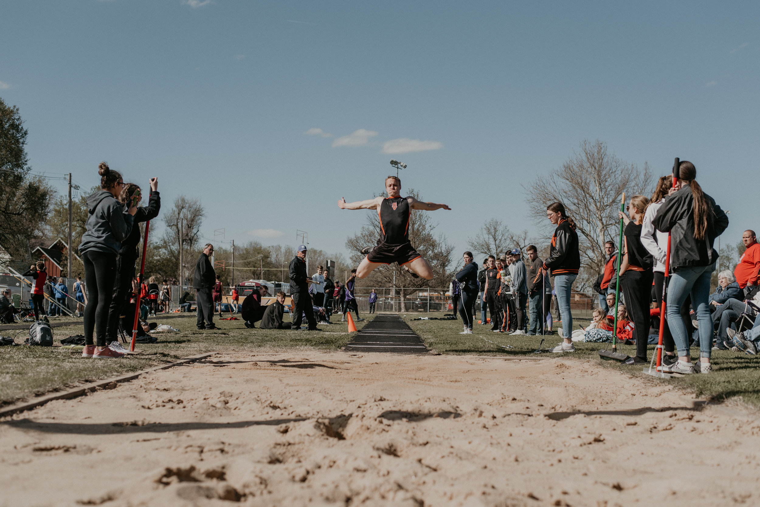 Vikings’ Carson Windholz takes to the air for a win in the triple jump with a tape measure 40’ 6” jump to victory.