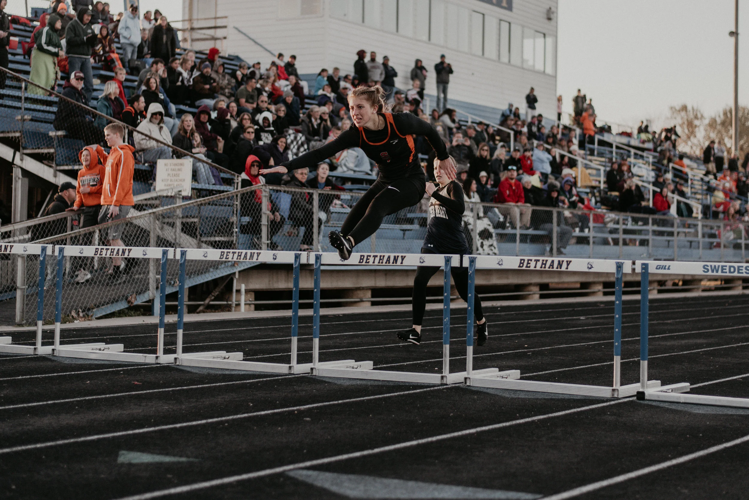 Smoky Valley’s Kerington Haxton nears the finish line as her 49.27-second dash earns her first place in the hurdles.