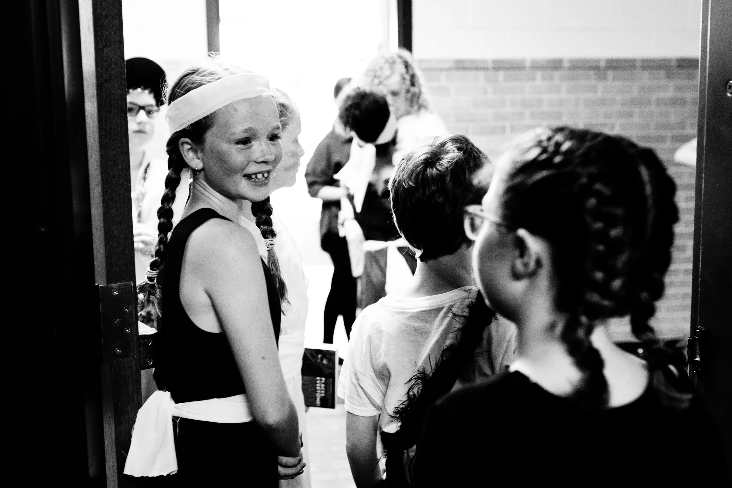 Jersey Elseth flashes a smile to her Brave Girl cast members before they hit the stage.