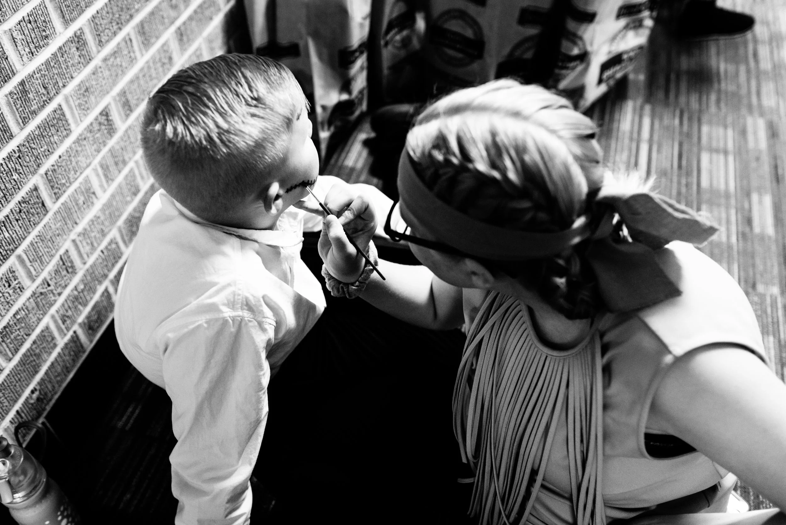 Marik Anderson (Jukes) has his pirate stitches painted on his cheek back stage.