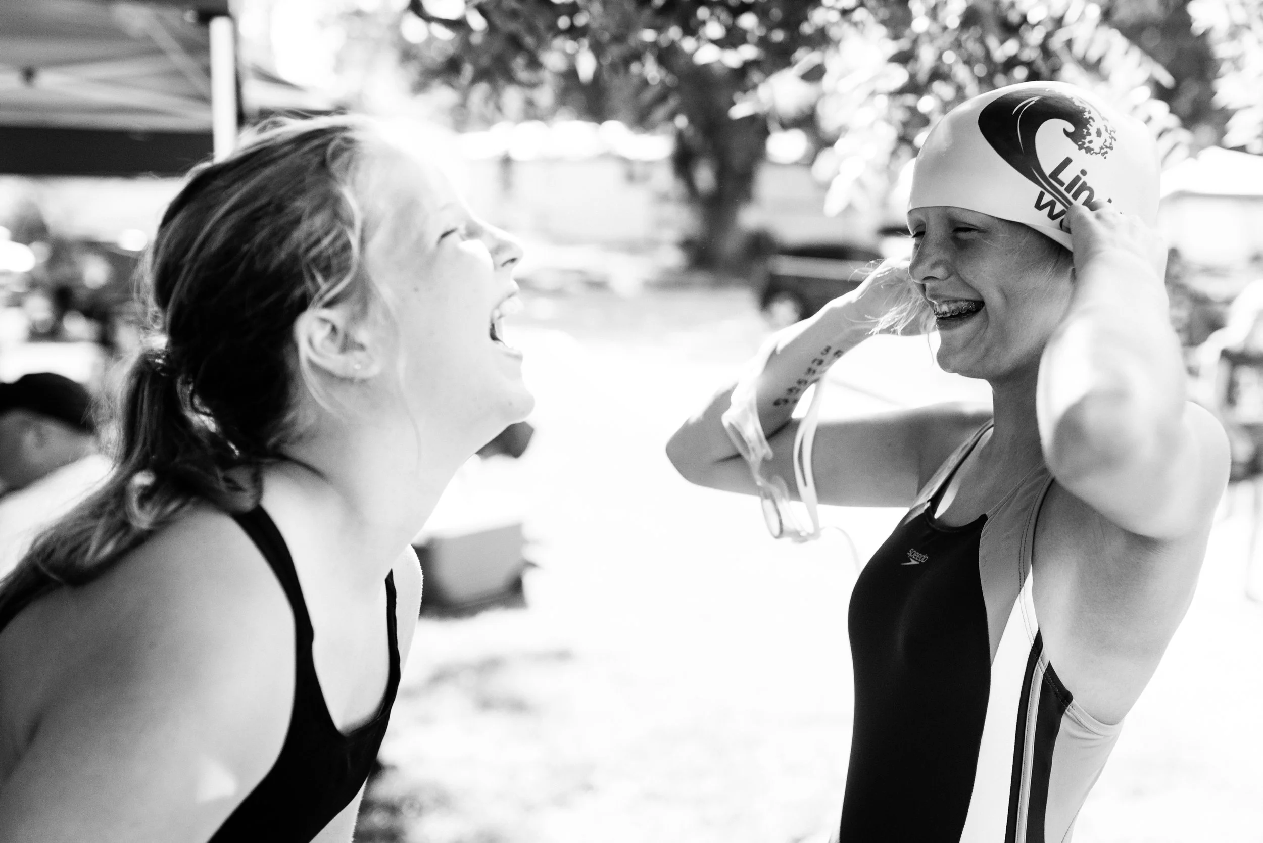 Swimming Smiles. Navaeh Spitler (L) and Isabelle Fanning share a laugh on Saturday.