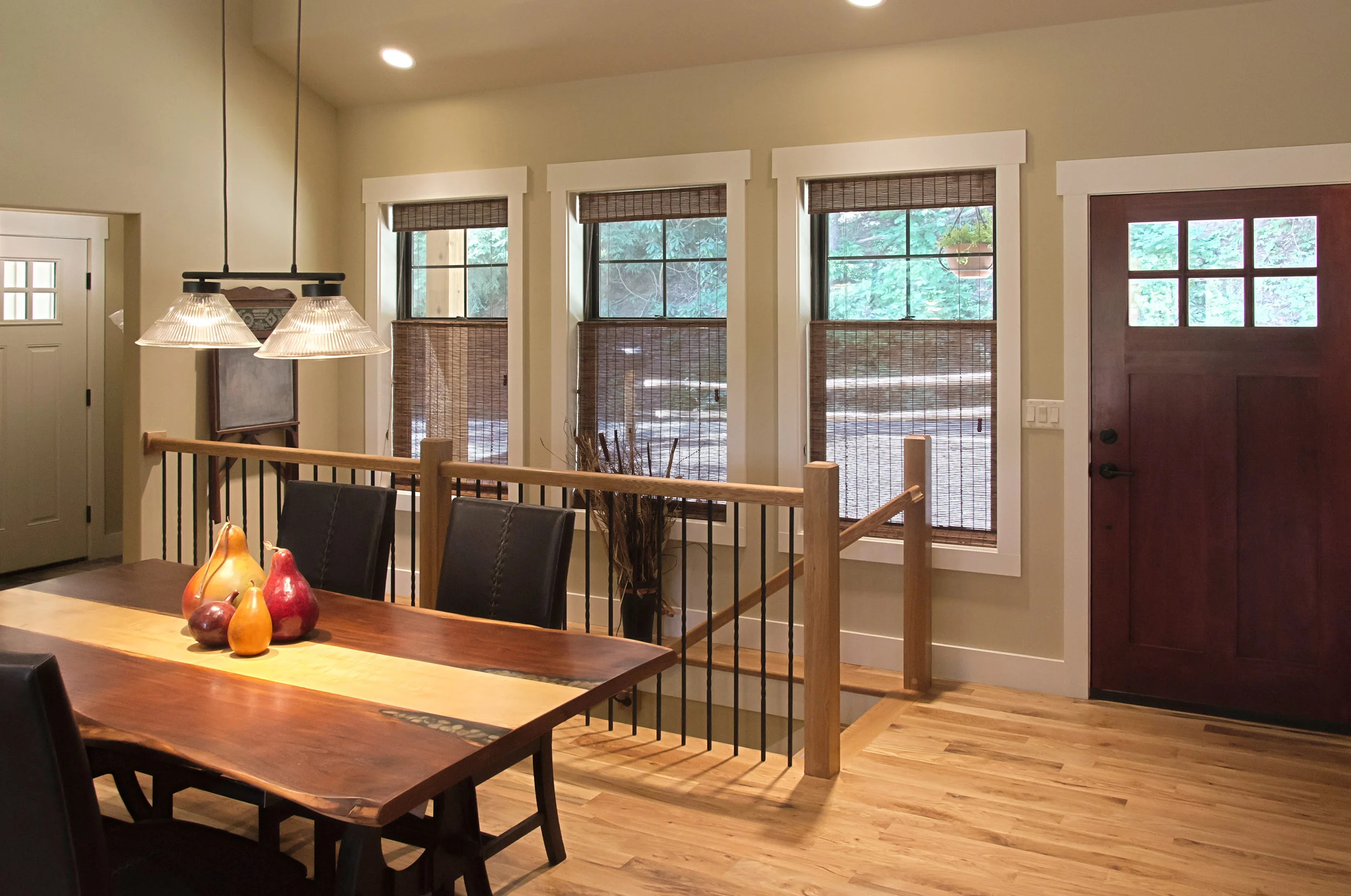 The wood accents on the interior, paired with the warm finishes on the cabinetry and countertops and wood tongue and groove ceilings, make this cozy home all the more inviting on the inside. 