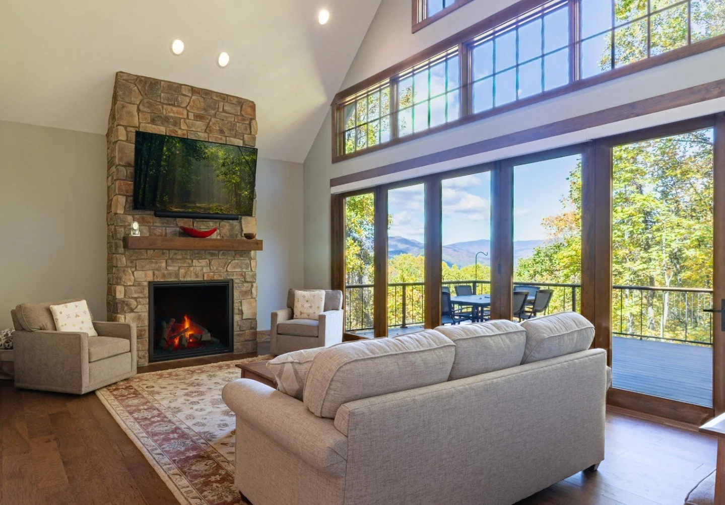 Swipe for some cozy living inspo 🍂🧺☕️⁠
⁠
Mountain homes need to balance two things: staying connected to the outdoors and staying comfortable inside.⁠
⁠
We solve this with dual fireplaces (one inside, one out), strategic window placement that bring