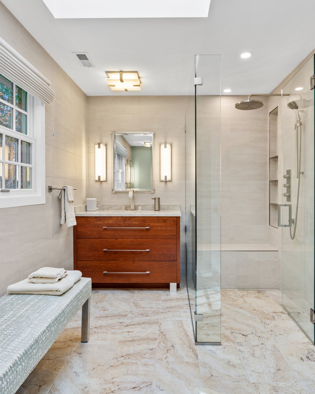 Is anyone else experiencing this winter weather and wishing they had heated bathroom floors? 🥶 ⁠
⁠
We installed WarmlyYours radiant heating under these stunning Scabo Silver tiles, plus an Amba Quadro towel warmer that heats to your perfect temperat