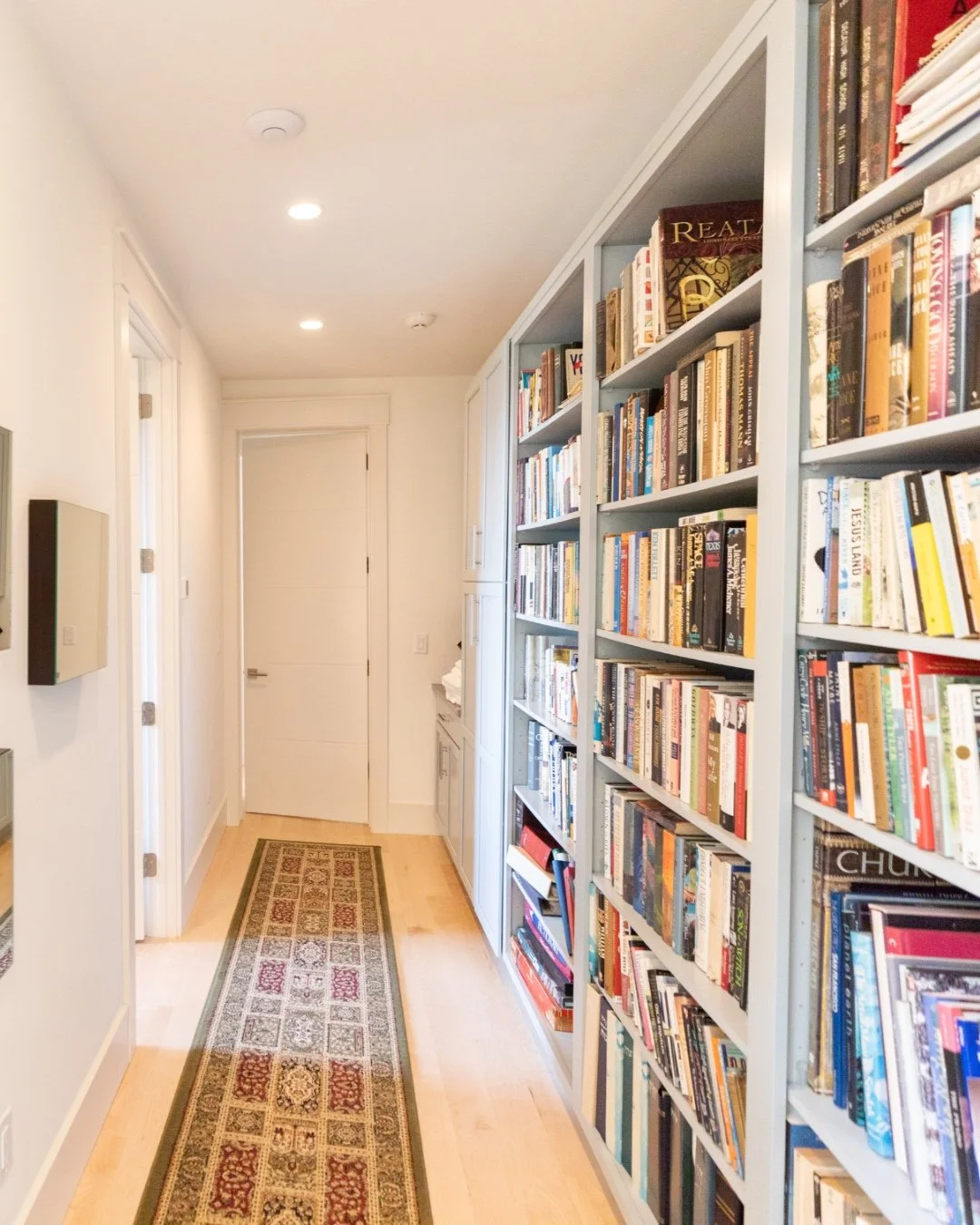 A hallway can do more than just connect rooms.⁠
⁠
These built-in bookshelves turned an otherwise empty stretch of wall into functional storage. ⁠
⁠
As custom home builders, we love integrating storage solutions to make our clients' homes feel functio