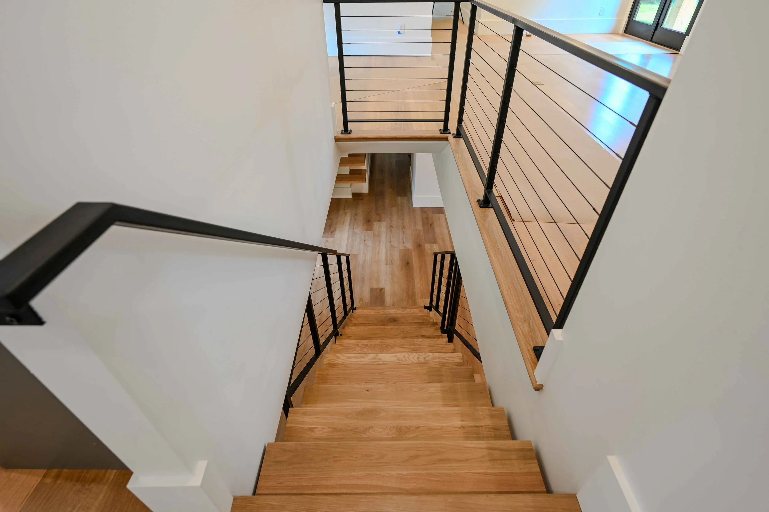 Asheville Country Club-floating-steel-staircase-white-oak-treads-modern.jpg
