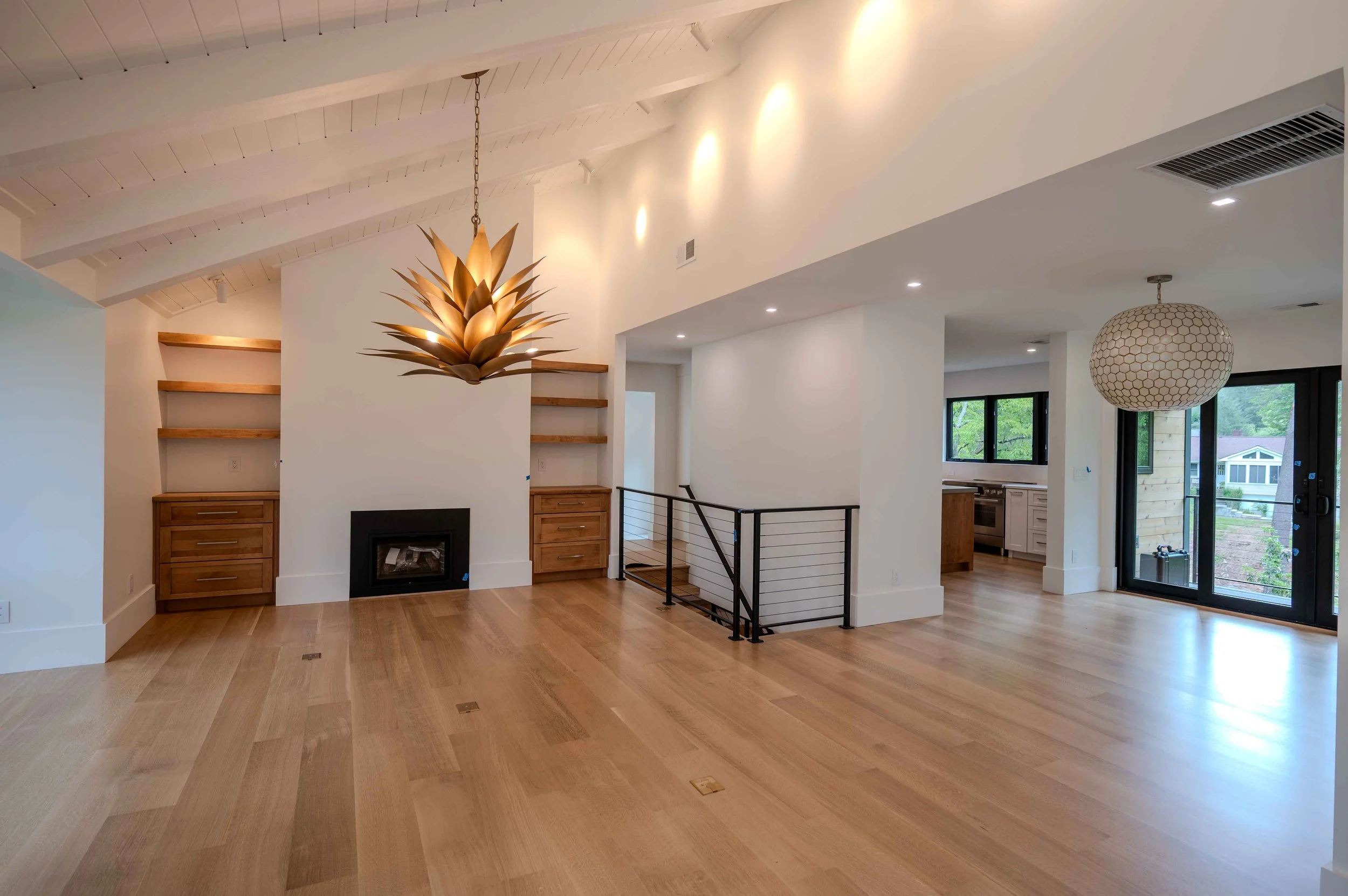 Asheville Country Club-modern-living-room-exposed-beams-floating-shelves.jpg