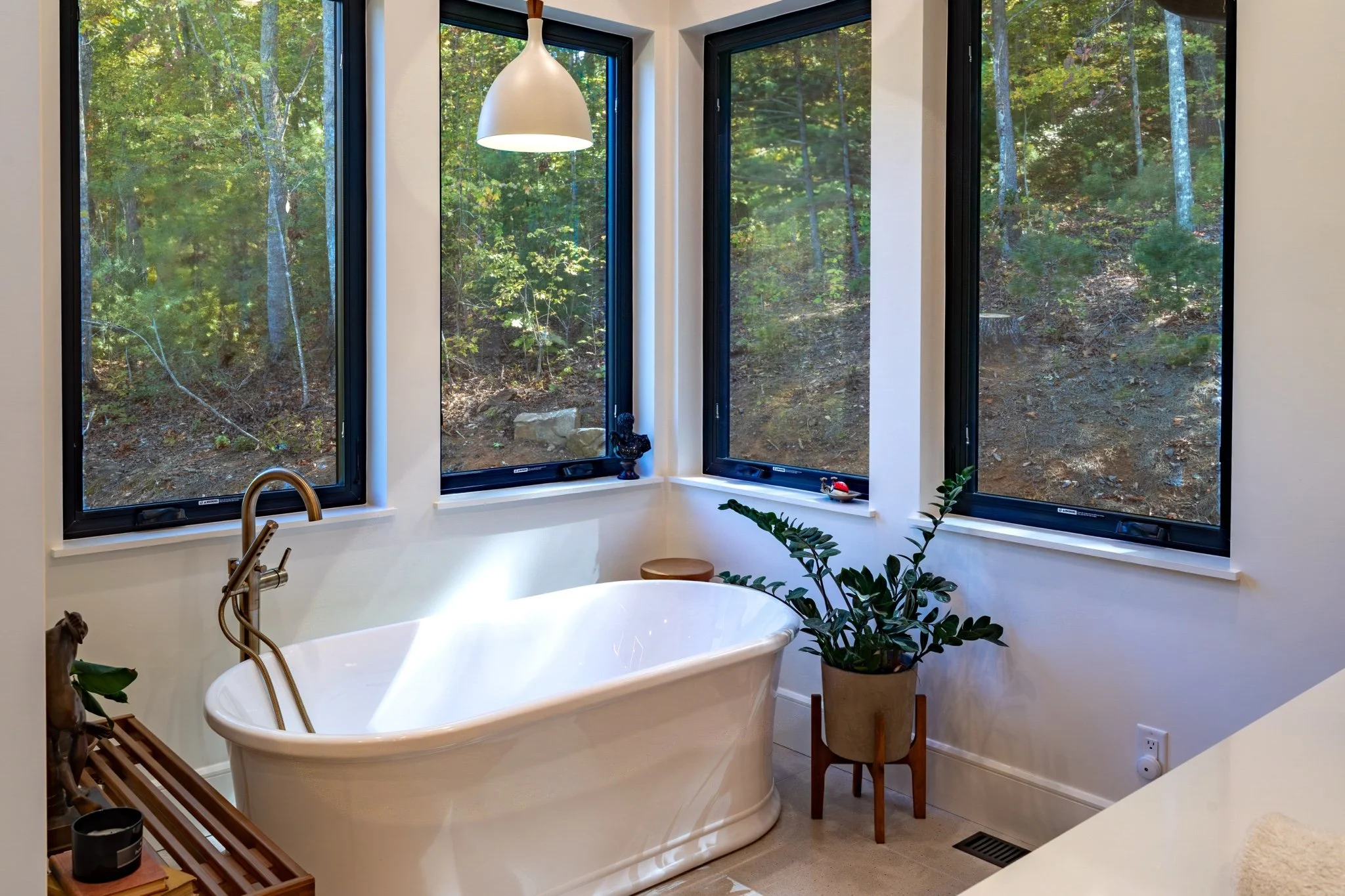 homesource-primary-bath-freestanding-soaking-tub-forest-windows.jpg