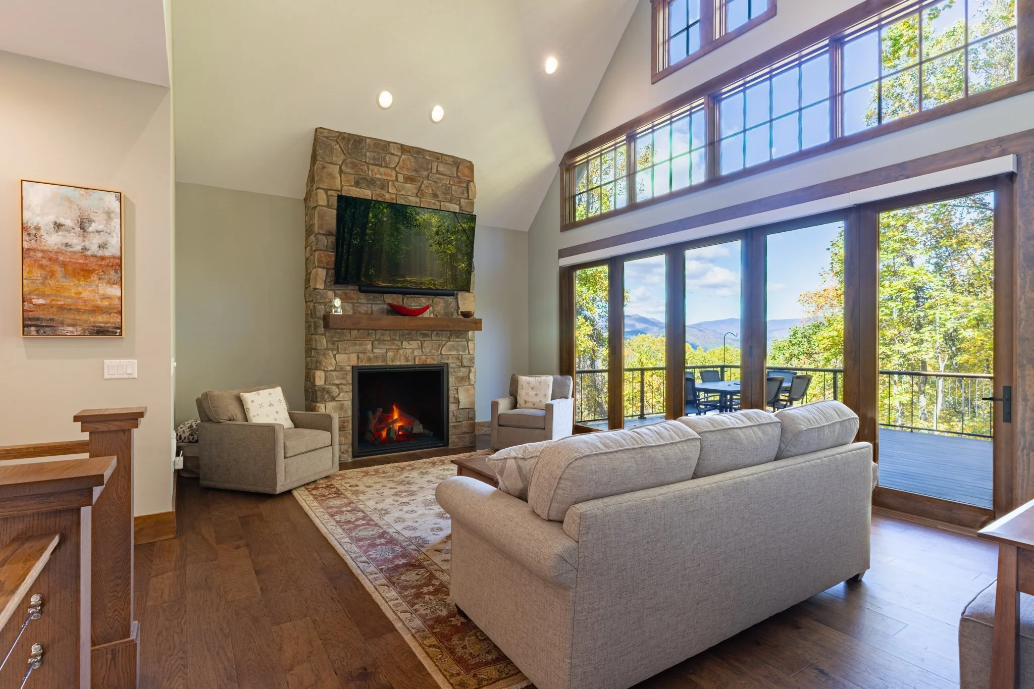 asheville-custom-home-great-room-stone-fireplace-mountain-views.jpg