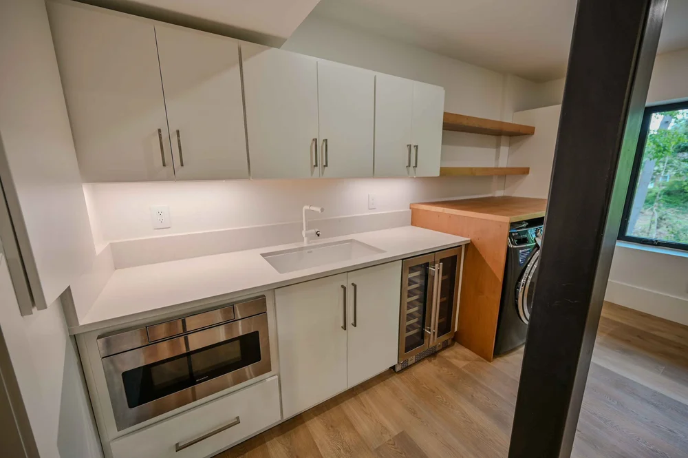 Asheville Country Club-white-laundry-room-built-in-appliances-renovation.jpg