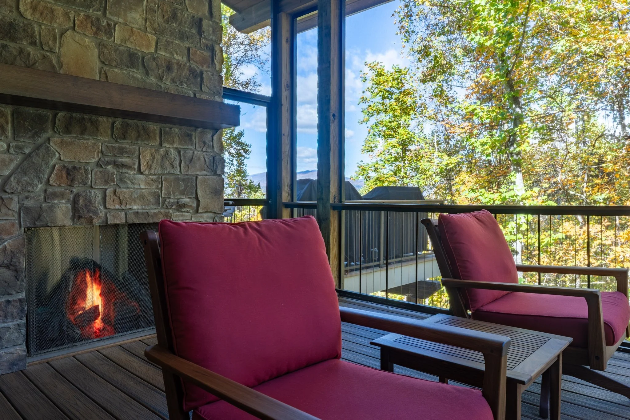 screened-porch-outdoor-fireplace-mountain-views.jpg