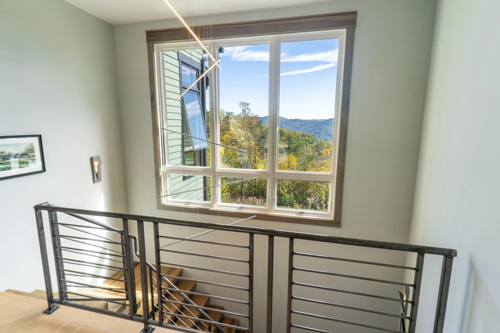 homesource-builders-custom-home-staircase-landing-mountain-views.jpg