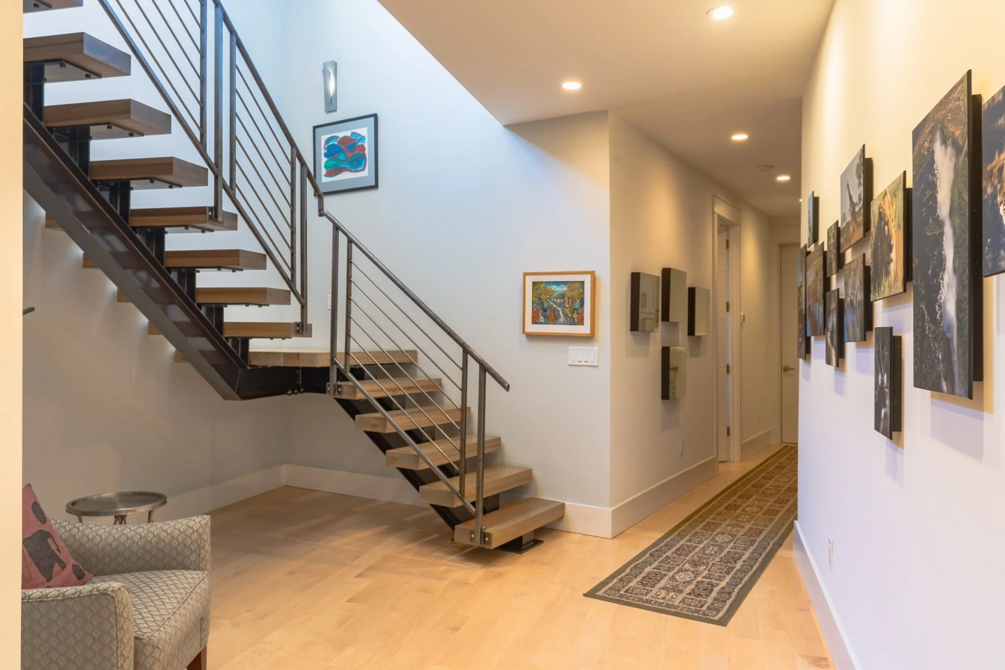 homesource-builders-custom-home-floating-staircase-gallery-hallway.jpg