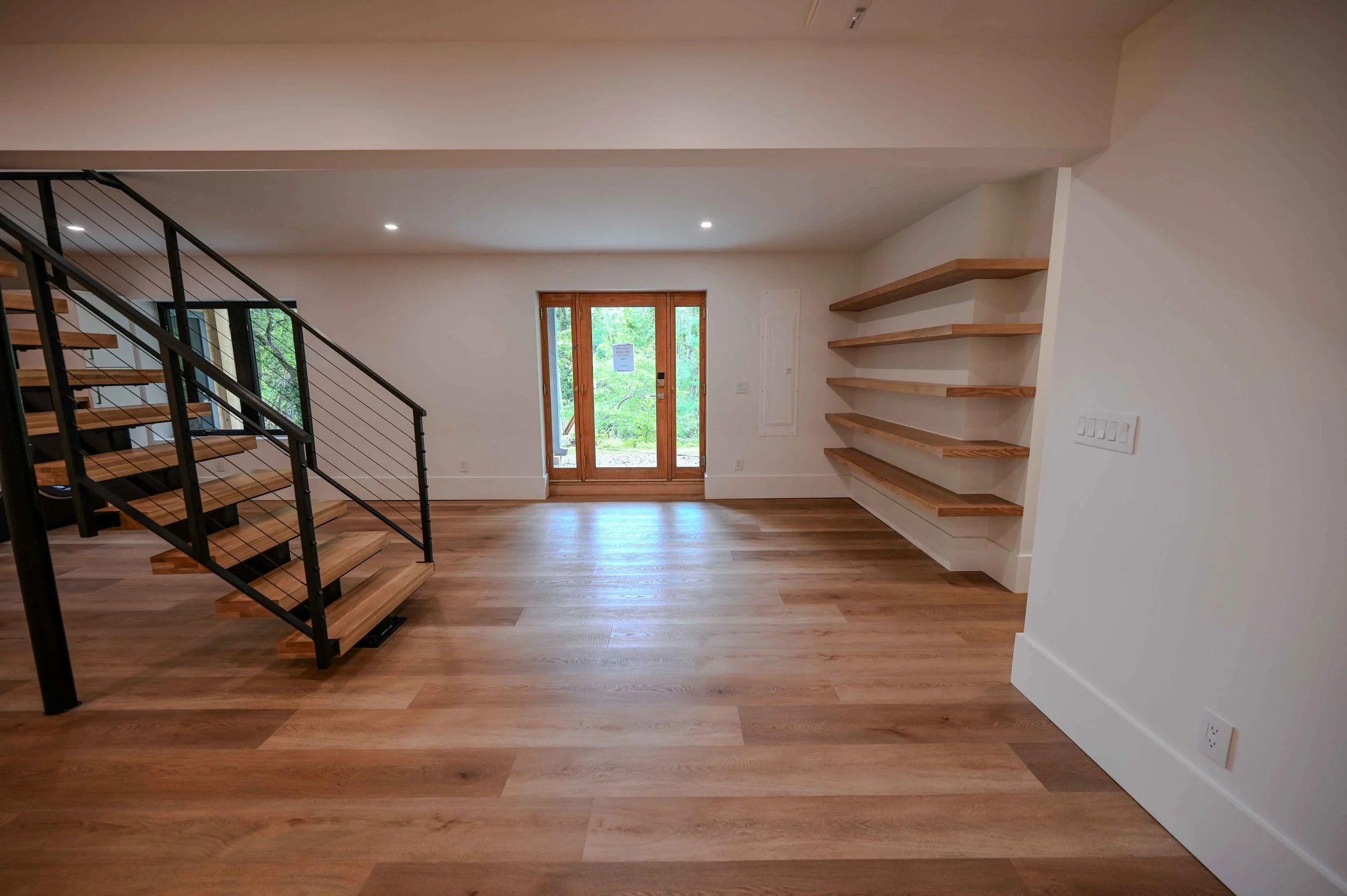 Asheville Country Club-floating-wood-shelves-modern-living-room-asheville.jpg