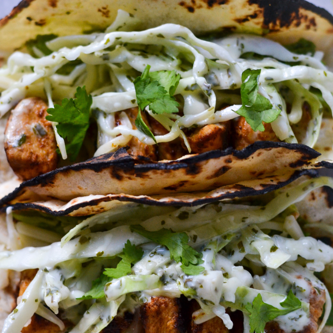 Bayou blaze chicken tacos — grilled spiced chicken tacos with cabbage slaw and fresh herbs, The Tea Tree