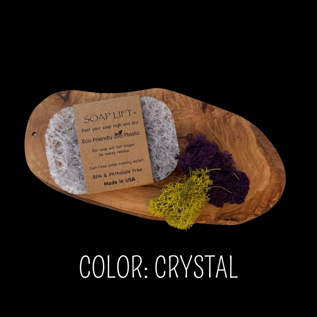 Crystal Soap Lift eco-friendly bio plastic soap dish on a dark rustic wood surface