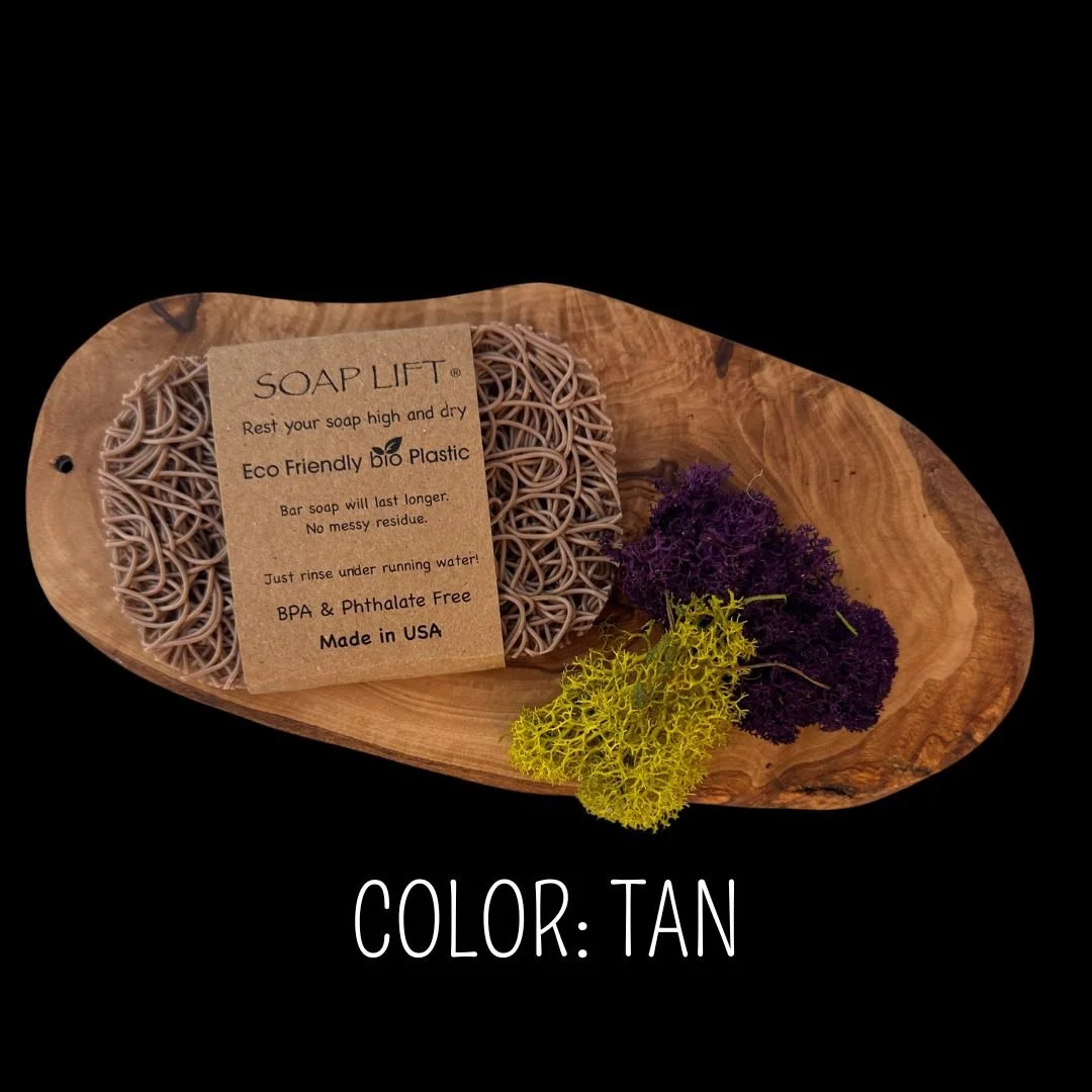 Tan Soap Lift eco-friendly bio plastic soap dish on a dark rustic wood surface