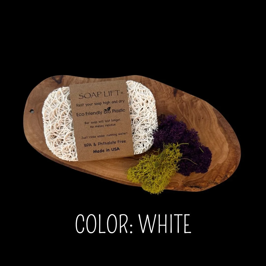 White Soap Lift eco-friendly bio plastic soap dish on a dark rustic wood surface