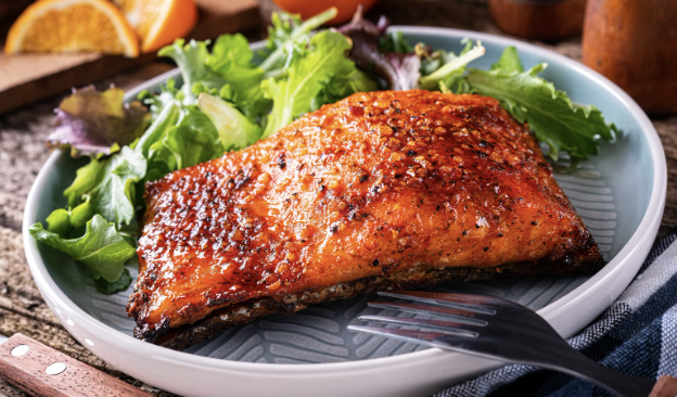 Citrus pear glazed salmon — pan-seared salmon fillet with citrus glaze and fresh greens, The Tea Tree