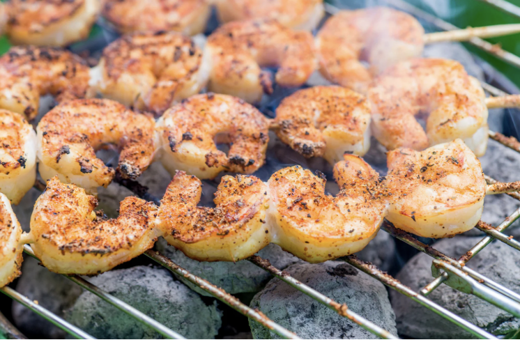 Butter and peach shrimp skewers — grilled seasoned shrimp skewers on the grill, The Tea Tree