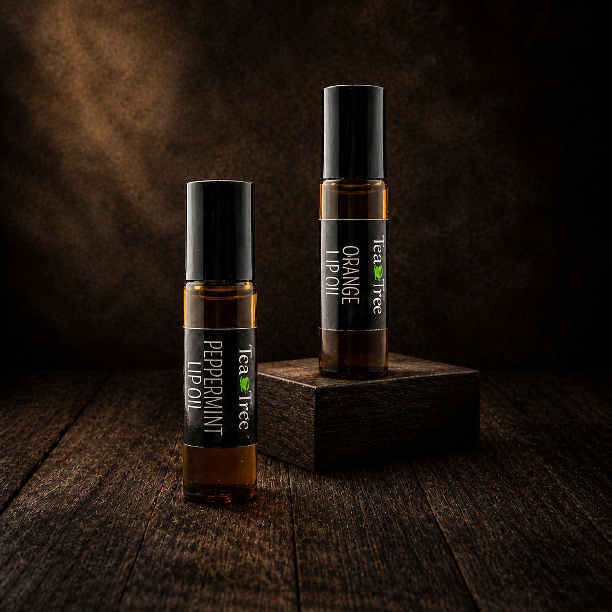 Two 10 mL lip oil rollers in jojoba oil — sweet orange and peppermint