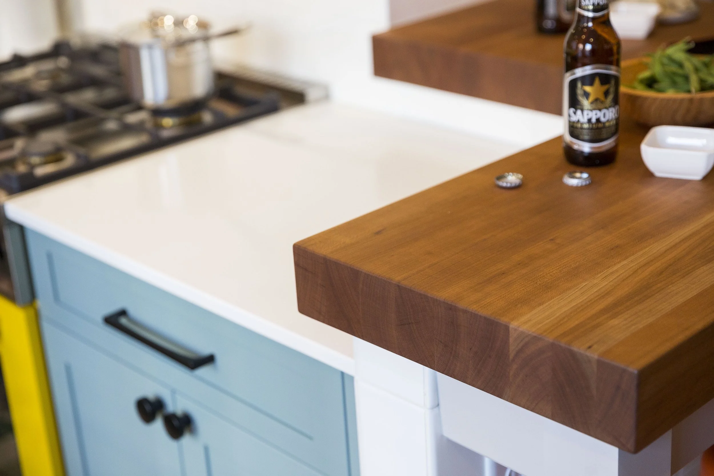 fun kitchen remodel with white and butcher block countertops