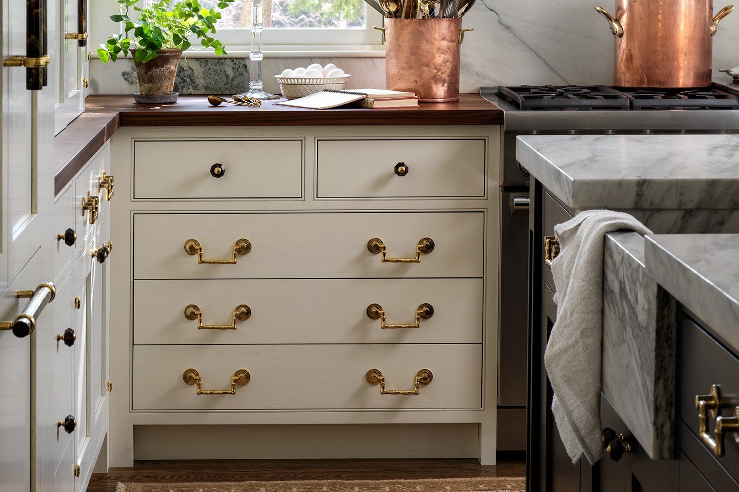 custom white cabinet drawers with brass hardware