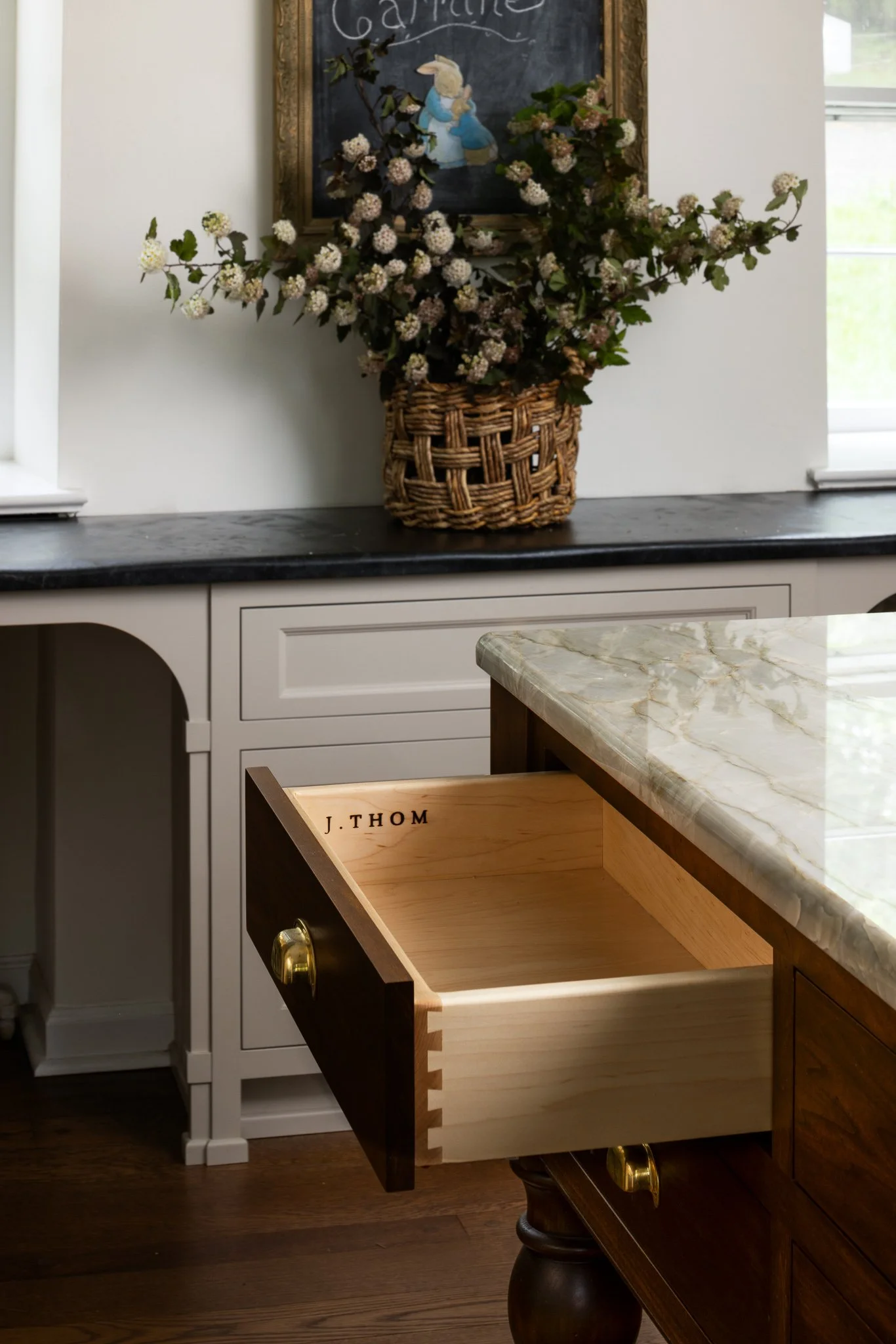 custom kitchen island with j thom signature cabinetry inset construction and integrated storage design