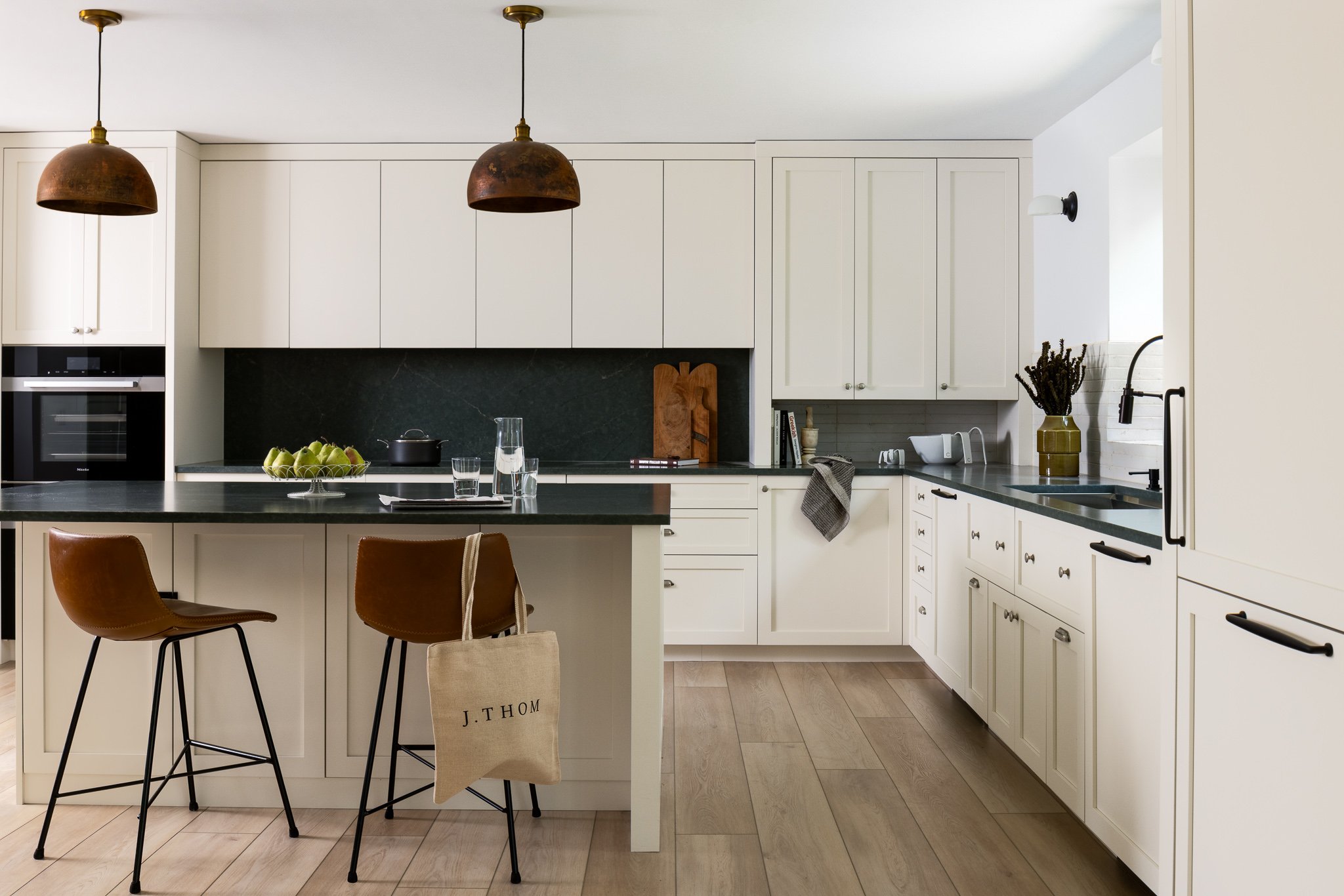 shaker kitchen with induction cooktop and stone backsplash philadelphia kitchen design