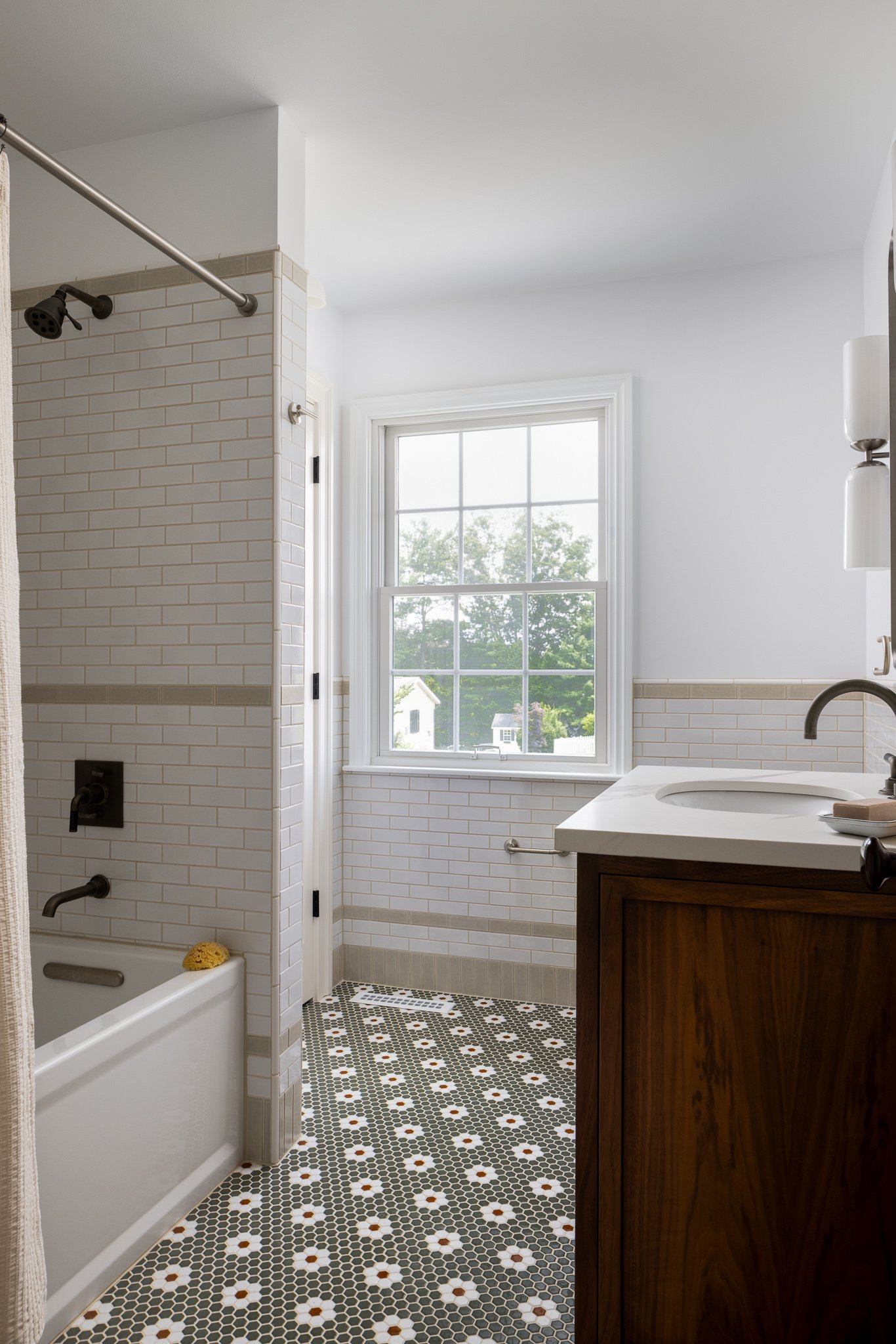 kids bathroom with walnut vanity and green tub shower philadelphia residential design