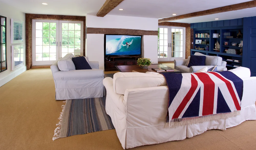 The screening room with deep sofas and a large flatscreen television