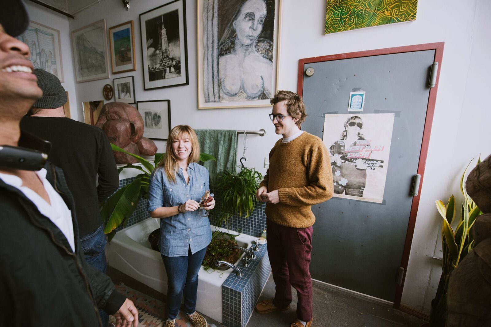 Hoar stands in his bathroom beside artworks of Deborah Masters . Photo: Randall Bellows III
