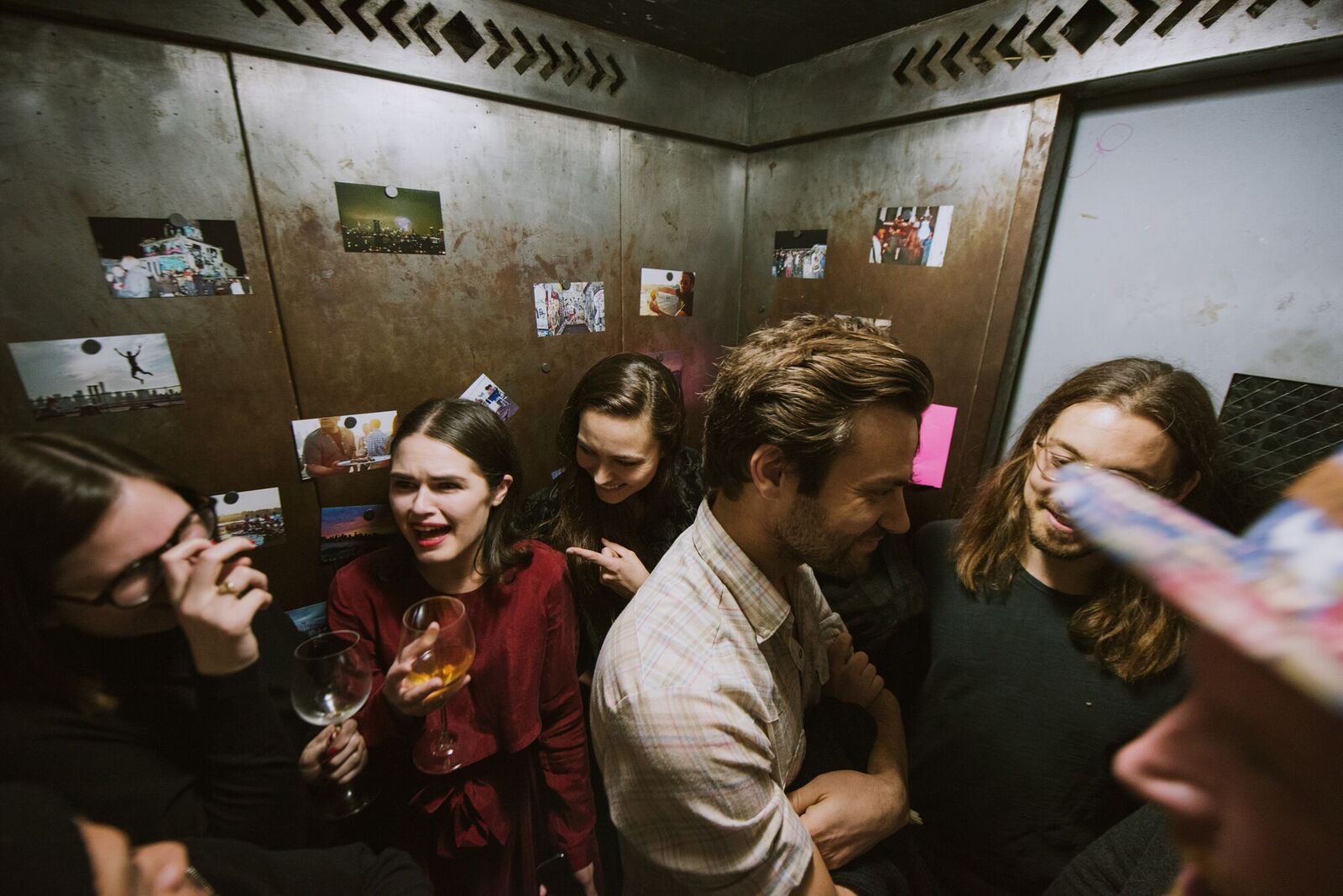 475KentFest attendees ride the elevator filled with photos of building life. Photo: Randall Bellows III