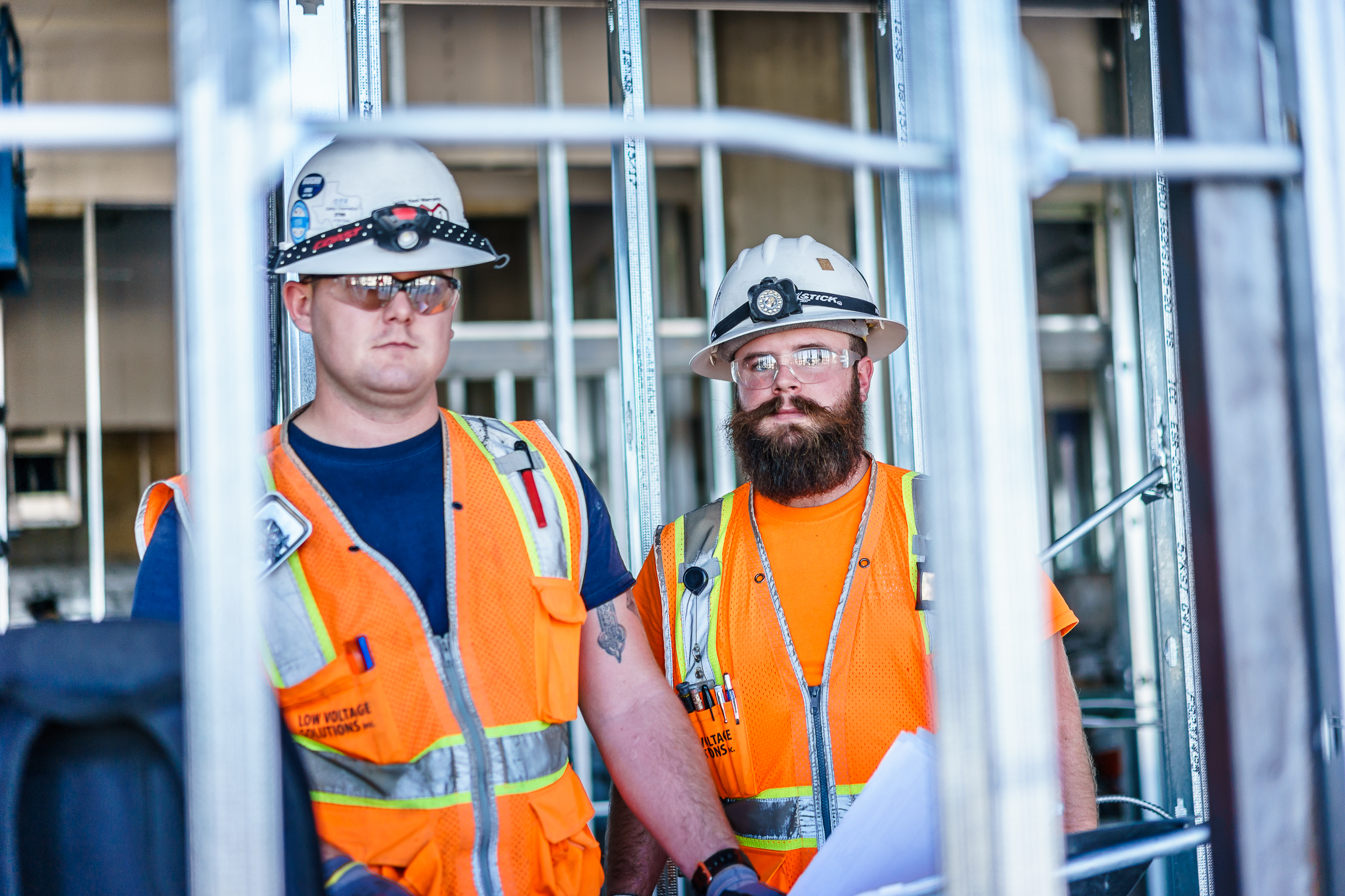 Two Low Voltage Solutions employees smile for the camera