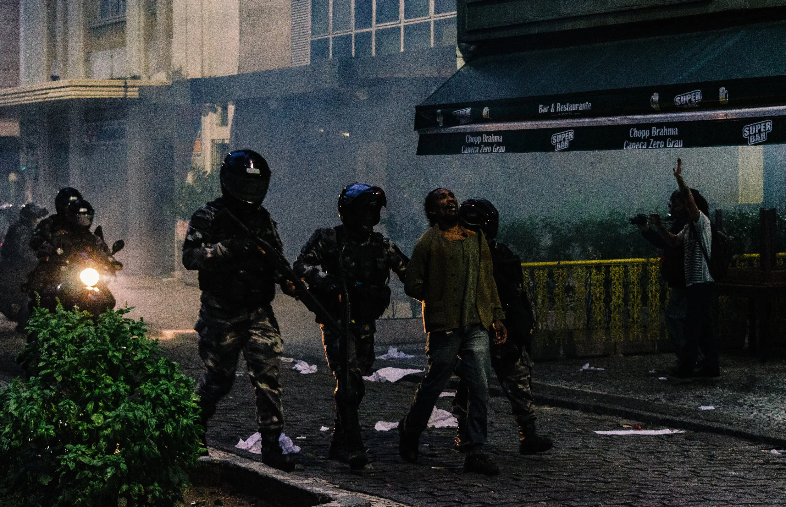 A man cries out in pain as he is arrested by members of Rio's elite Choque Battalion. There have been complaints of excess force being used against civilians by the state's military police.