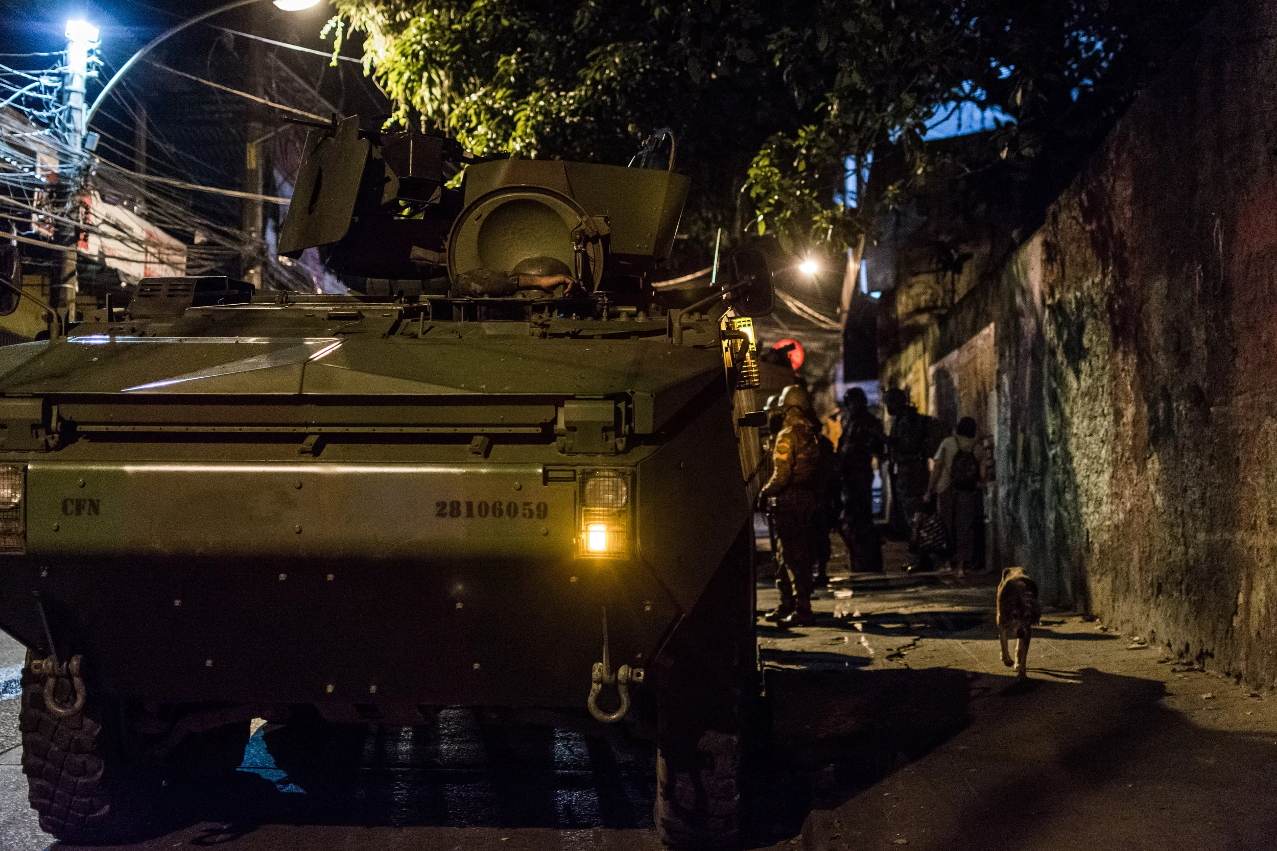 VBTP-MR Guarani of the Brazilian armed forces sets up a checkpoint near the base of the community.