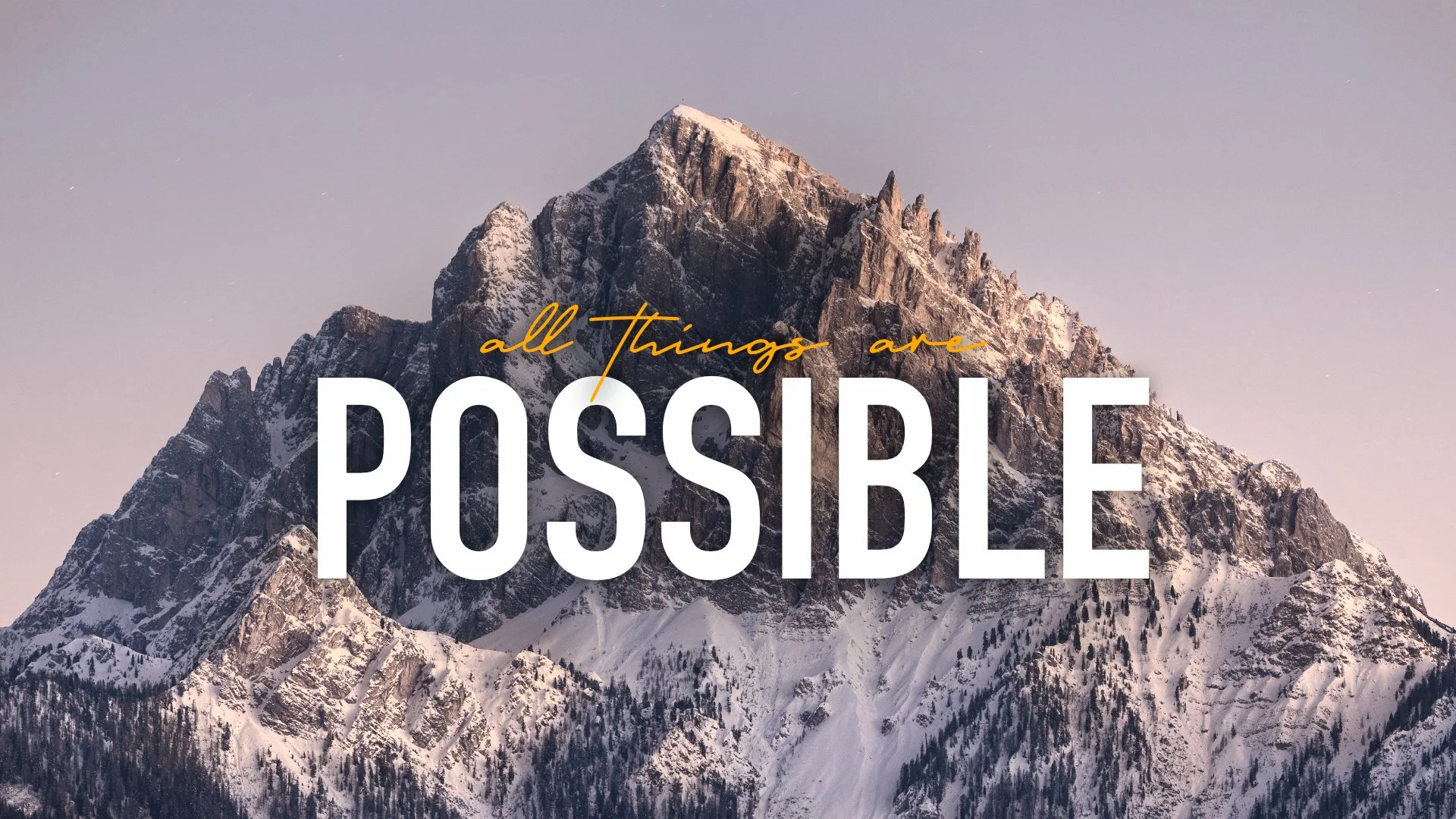 Snow-covered mountain with a quote that says 'all things are possible' written across it.