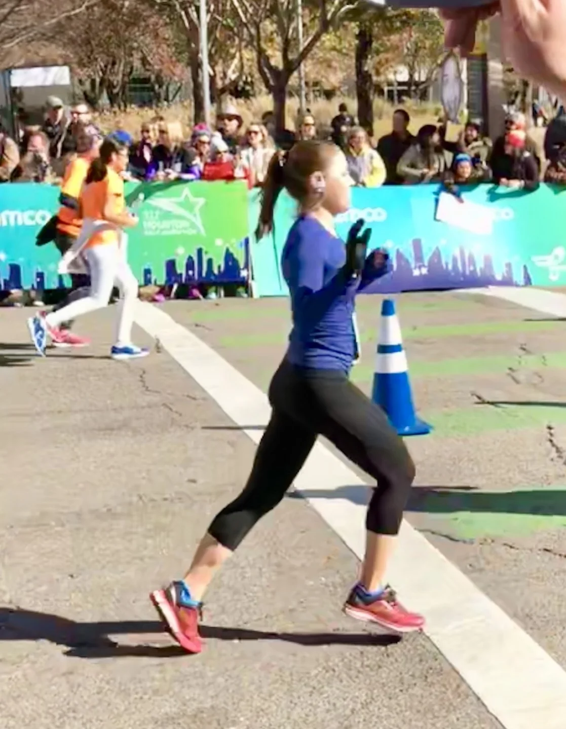 Krista crossing the finish line at the Houston Marathon 2018