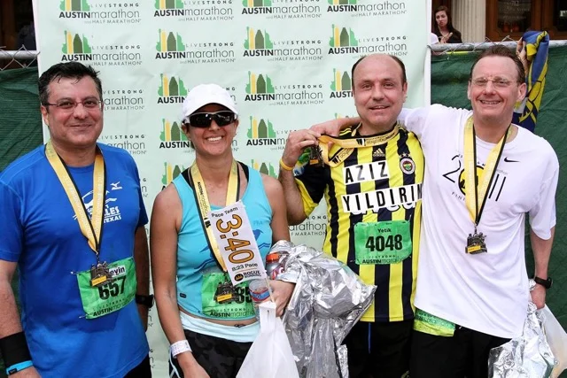 (left to right) Huseyin Tanriverdi, Amy, Yetik Serbest, and Peter Flemings after the Austin Marathon 2012