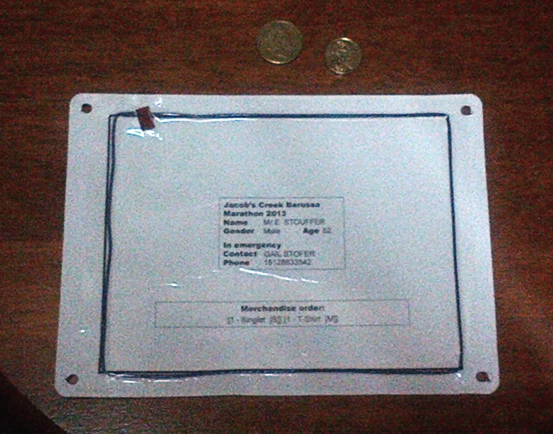 The back of the home made bibs used in the Jacob's Creek Half marathon in Barossa Valley Australia. Yes, that is a wire hand taped around in a ring to trigger the sensor! That was this decade, not some 20th century thingy. Classic!