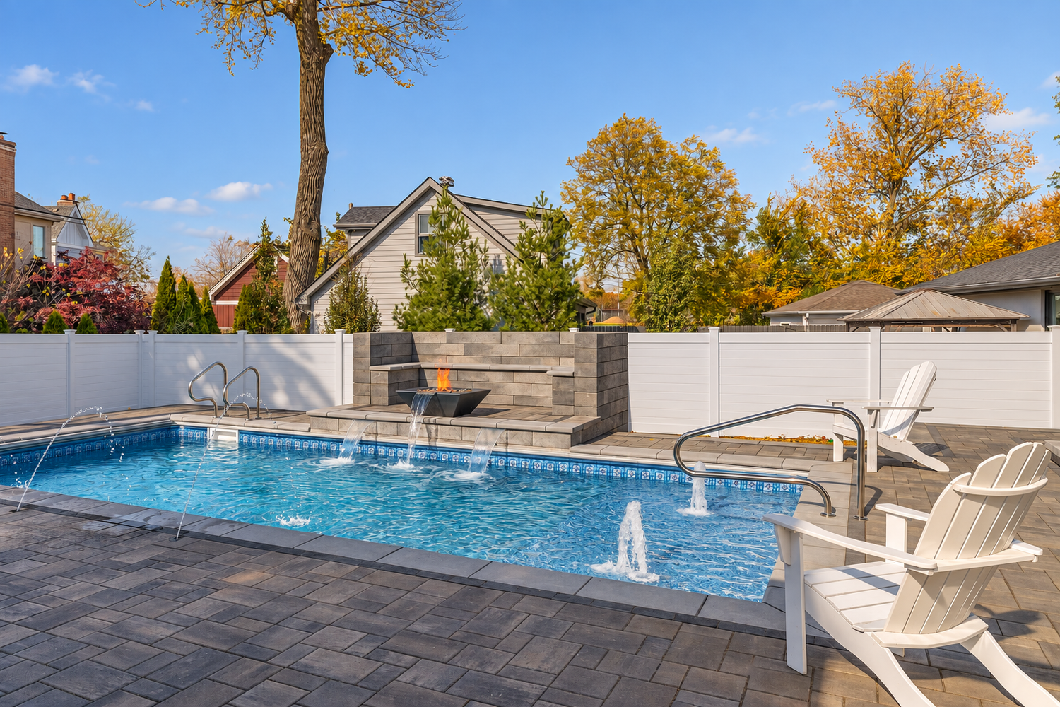 Completed pool with water features and fire feature