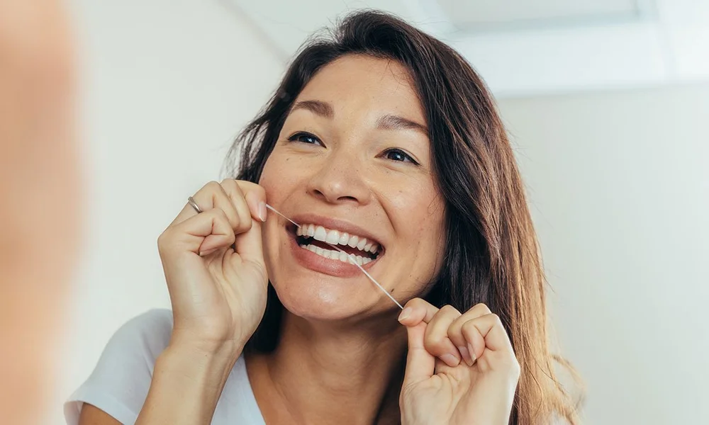 Water flosser vs traditional dental floss — EMERGENCY DENTIST SYDNEY