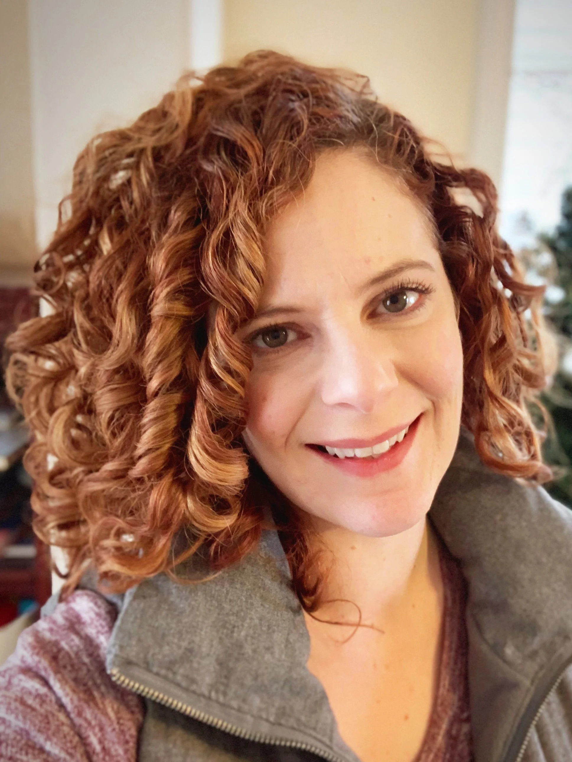 Sarah Vendittelli of Thoroughly Curly Designs, specializing in branding, print, and web design for creatively conscious small businesses.