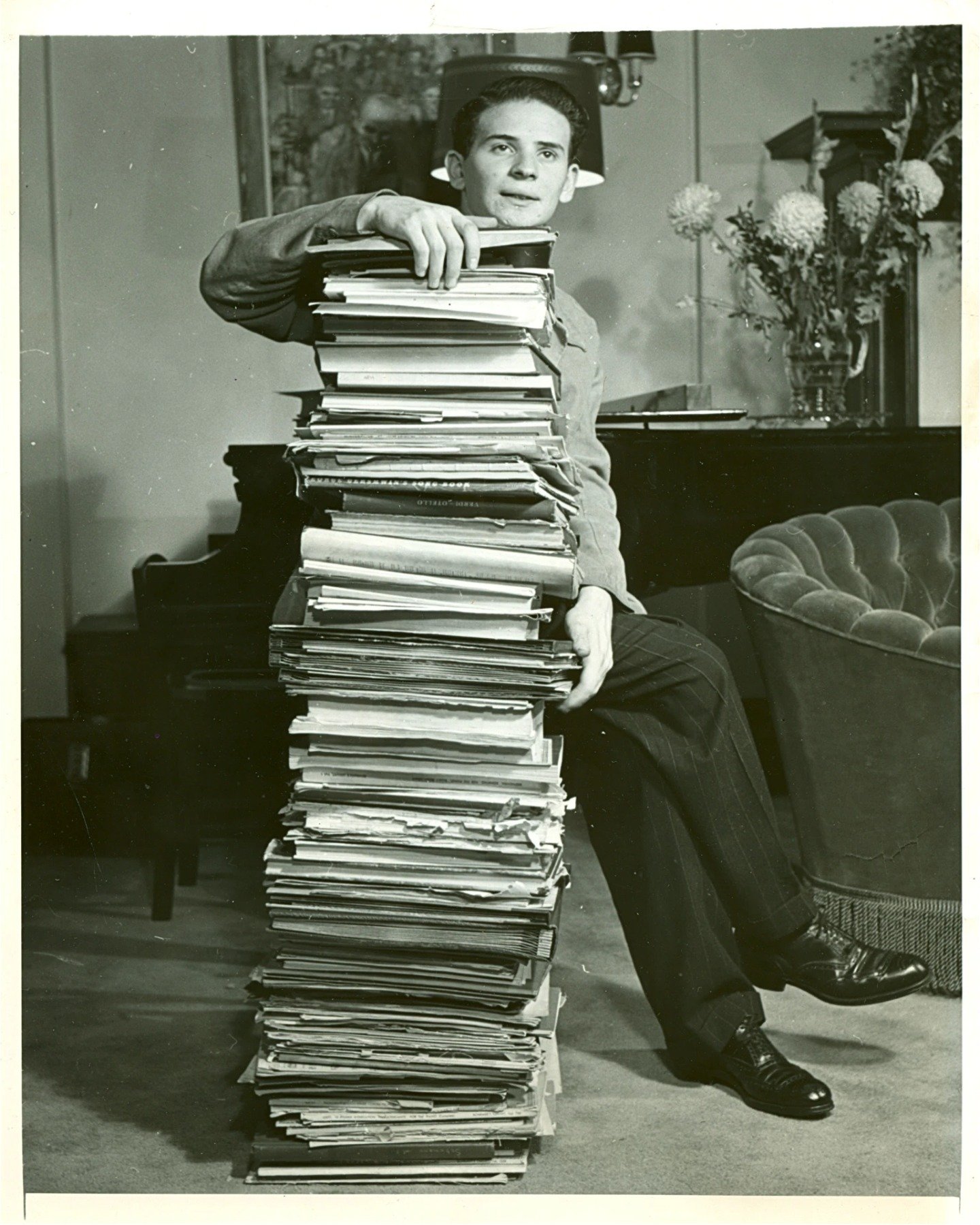 Transporting us back in time to 1948, here's a captivating throwback of Byron Janis immersed in a sea of musical manuscripts. 🕰️🎹 This mesmerizing snapshot captures a moment of inspiration and dedication as Byron delves into the depths of musical g