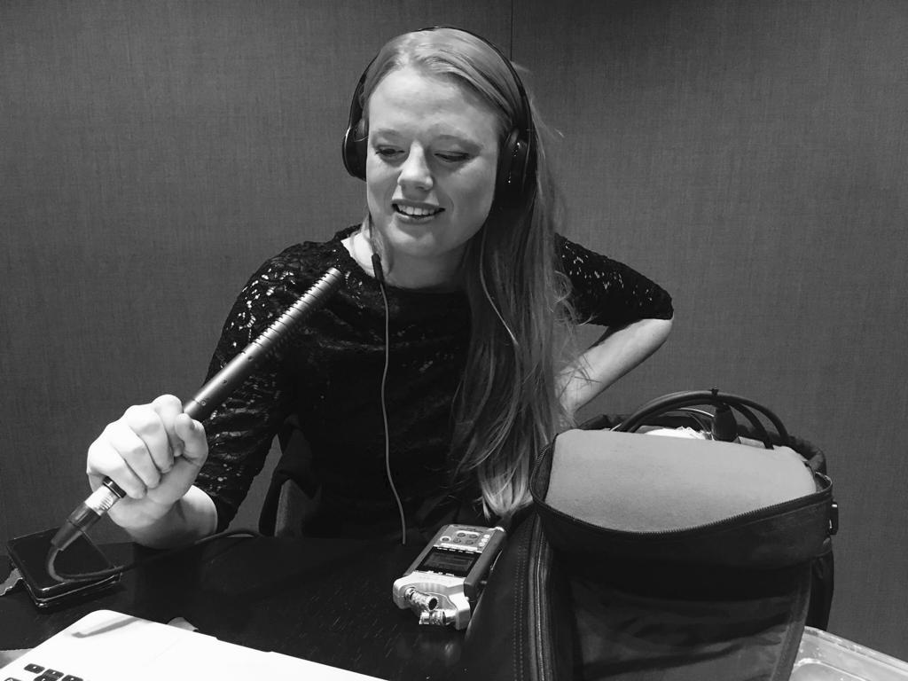 Caroline in action recording a podcast