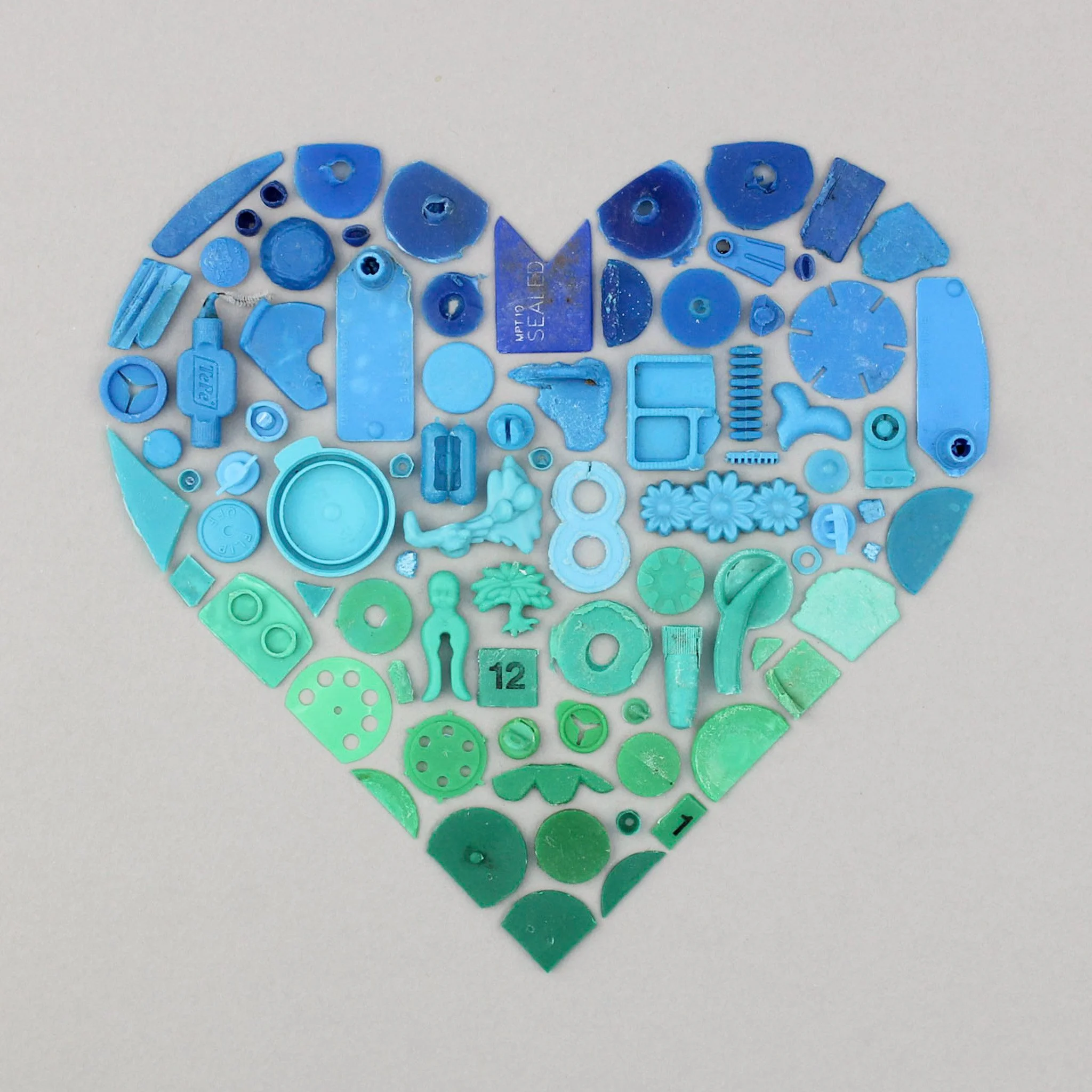  A heart of blue and green beach plastic 