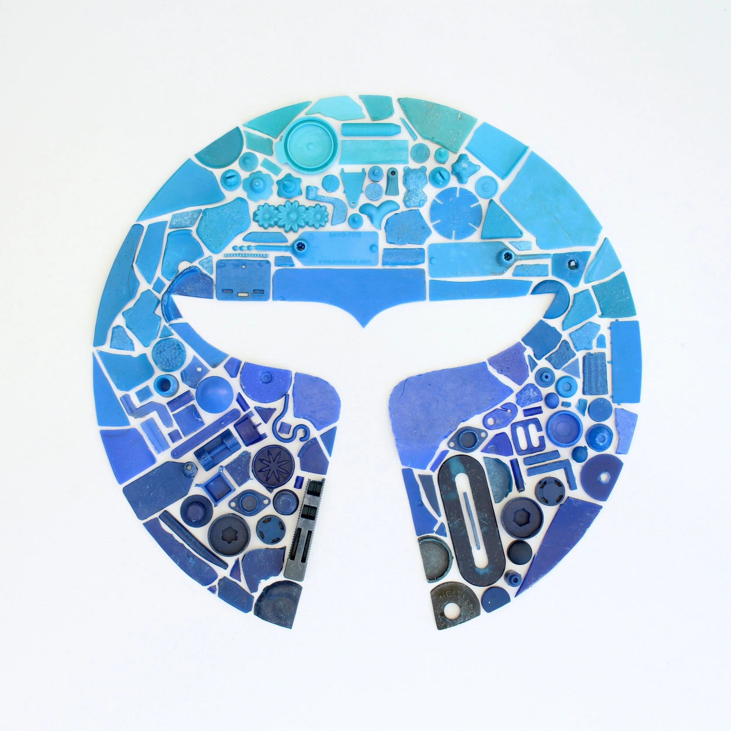  Replicating the logo for Whalar using beach plastic in a gradient of blue's 