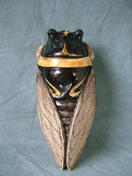 Victorian, circa 1900, Clement Massier Majolica wall pocket which features the pocket modelled in the form of a cicada, wings tucked behind its back.