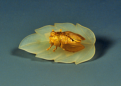 Gold cicada on jade leaf